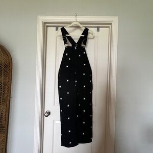 Black overalls with embroidered stars